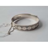A solid silver bangle with star decoration 30g
