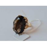 A very large oval smoky quartz 9ct dress ring size P 10.8g inc