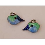 A pair of unusual antique silver and enamel parrot earrings