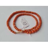 A graduated coral bead necklace with 9ct clasp