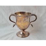 A plain George III cup with two plain handles, spreading base, 5.5" high, London 1790 by IK, 290g