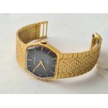 A gents Vintage Regency wrist watch with bi-coloured face on yellow metal flexible strap