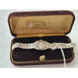 A ladies white gold plated Seiko wrist watch in original box