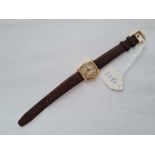 A gents wrist watch with seconds dial 9ct