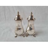 A pair of baluster shape pepper casters on pad feet - 4" high - London 1929 by Goldsmiths Co - 126