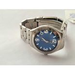 A gents blue faced Swatch wrist watch with seconds sweep and original metal strap and date aperture