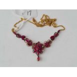 An attractive red stone necklace set with small diamonds set in 9ct gold - 11.7 g. inc