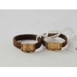 Two unusual antique plaited hair rings set with gold fronts