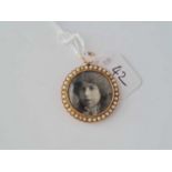 A Victorian pearl bordered 15ct photo locket