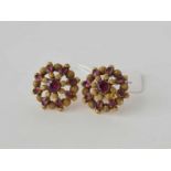 A pair of gold and garnet cluster earrings - 4.3 g.