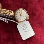 A ladies Tissot wrist watch 9ct with metal expandable strap