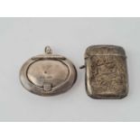 A silver vesta case and travelling compact