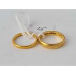 One wide and one slim 22ct wedding bands - size M and J - 6.7 g.