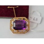 A pretty octagonal amethyst and seed pearl brooch set in a heavy yellow metal mount