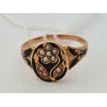 A gold and black enamel memorial ring set with pearls size Q 1/2 - 2.5 gms