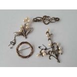 Four silver brooches