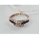 A silver gilt diamond and sapphire cross ring size O - 2.5 gms