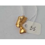 A 9ct charm in the form of a Pharaoh - 1.4 gms