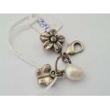 A three charm pendant on clasp inc silver butterfly flower and fresh water pearl