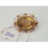 A fancy mounted brooch with large oval central citrine 9ct - 9.1 gms inc