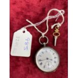 A ladies silver fob watch with key and seconds dial W/O