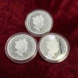 Three silver proof crowns