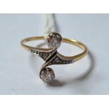 A UNUSUAL TWO STONE DIAMOND CROSS OVER RING 18CT GOLD SIZE Q