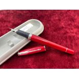 A good condition red Parker fountain pen IM series with fine new nib
