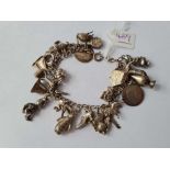 A silver charm bracelet - 55 gms