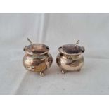 Small pair of cauldron shaped mustard pots, stamped silver