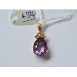 A diamond and amethyst pendant 14ct gold