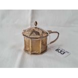 An octagonal mustard pot with B.G.L, Birmingham 1938 by WHH, 51g