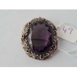 Arts and crafts white metal and amethyst brooch with hinged locket back