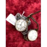 A silver trench watch and silver wrist watch