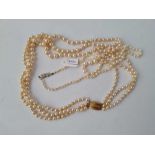 A Ciro three string pearl necklace with 9ct clasp together with another with white gold 9ct clasp