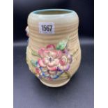 A Clarice Cliff vase decorated with flowers - 8.5" high