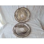 Pair Victorian circular salvers with chased decoration. 12 inch diameter