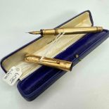 A good gilt Swan fountain pen with 14ct gold nib