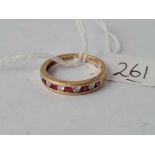 A ruby and diamond half eternity 9ct ring size M 2.3g