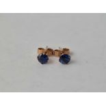 A pair of good colour sapphire and gold single stone earrings