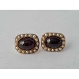 A VICTORIAN GOLD (TESTED) CABOCHON GARNET AND PEARL EARRINGS