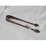 A pair of George III bright cut sugar tongs by script GW? Circa 1790