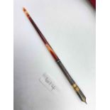 A old dip pen with long agate handle
