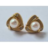 a pair of gold and diamond pearl earrings 14ct gold