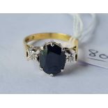 A sapphire and diamond 18ct gold three stone ring size Q 5.1g inc