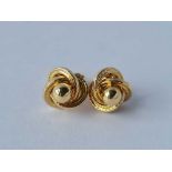 A pair of knot and ball 9ct earrings