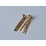 A pair of three colour drop strand earrings 9ct