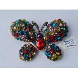A large fancy designer coloured multi stone butterfly brooch