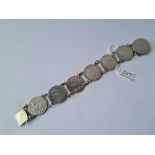A heavy silver coin bracelet the seven coins being 1826/7 George IV shillings