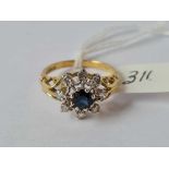 A sapphire and diamond ring 18ct gold size n -1.4 gms